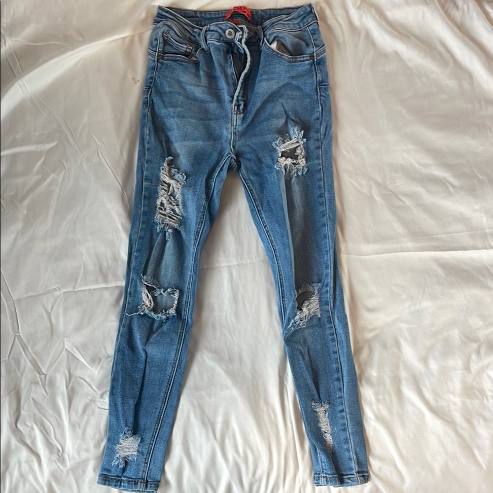 Distressed Blue Denim Jeans